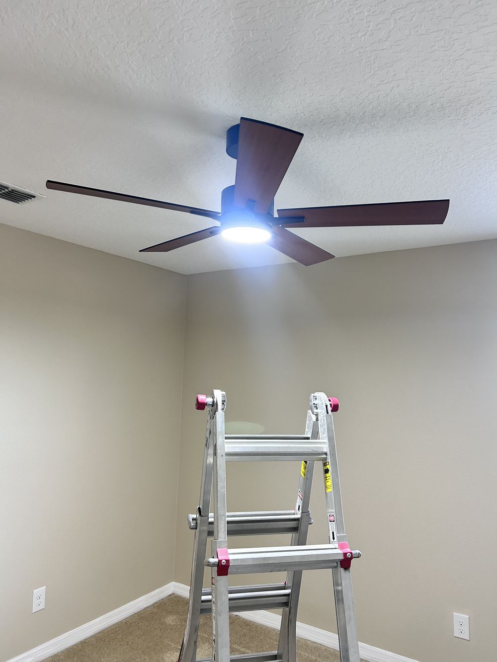 New ceiling fan with LED light installed in a bedroom